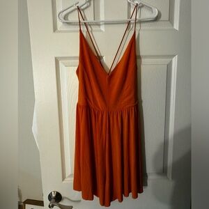Elegant Orange Spaghetti criss cross Strap romper